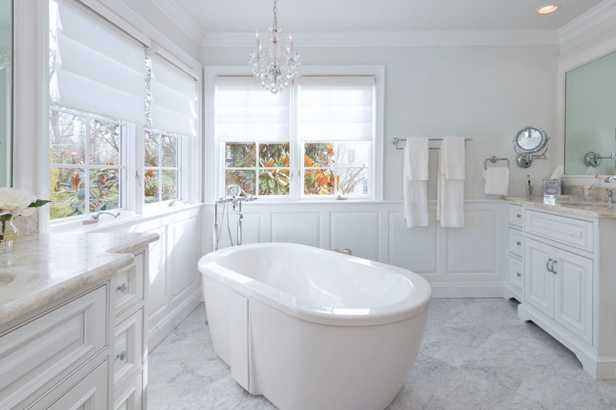 Antartide and Carrara stone installed on matching bathroom vanities