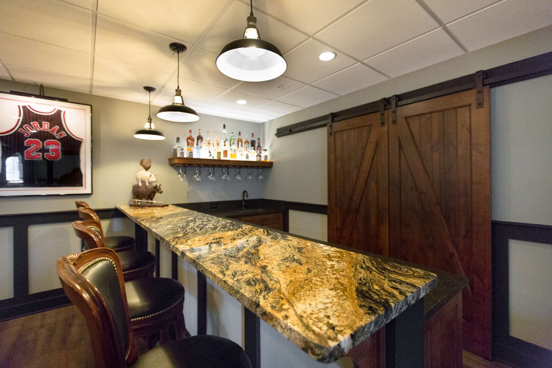 Black Pearl and Magma stone installed on a finished home bar