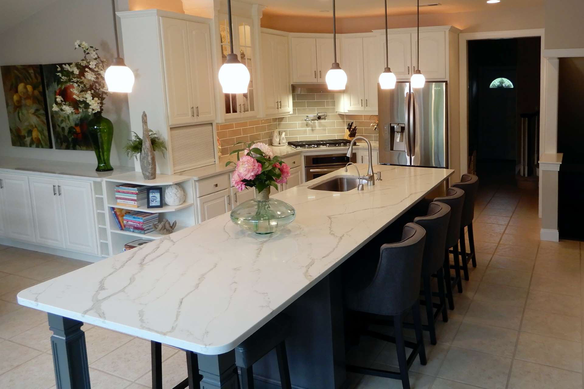 Calacatta Gold quartz kitchen island and perimeter countertops with white cabinets
