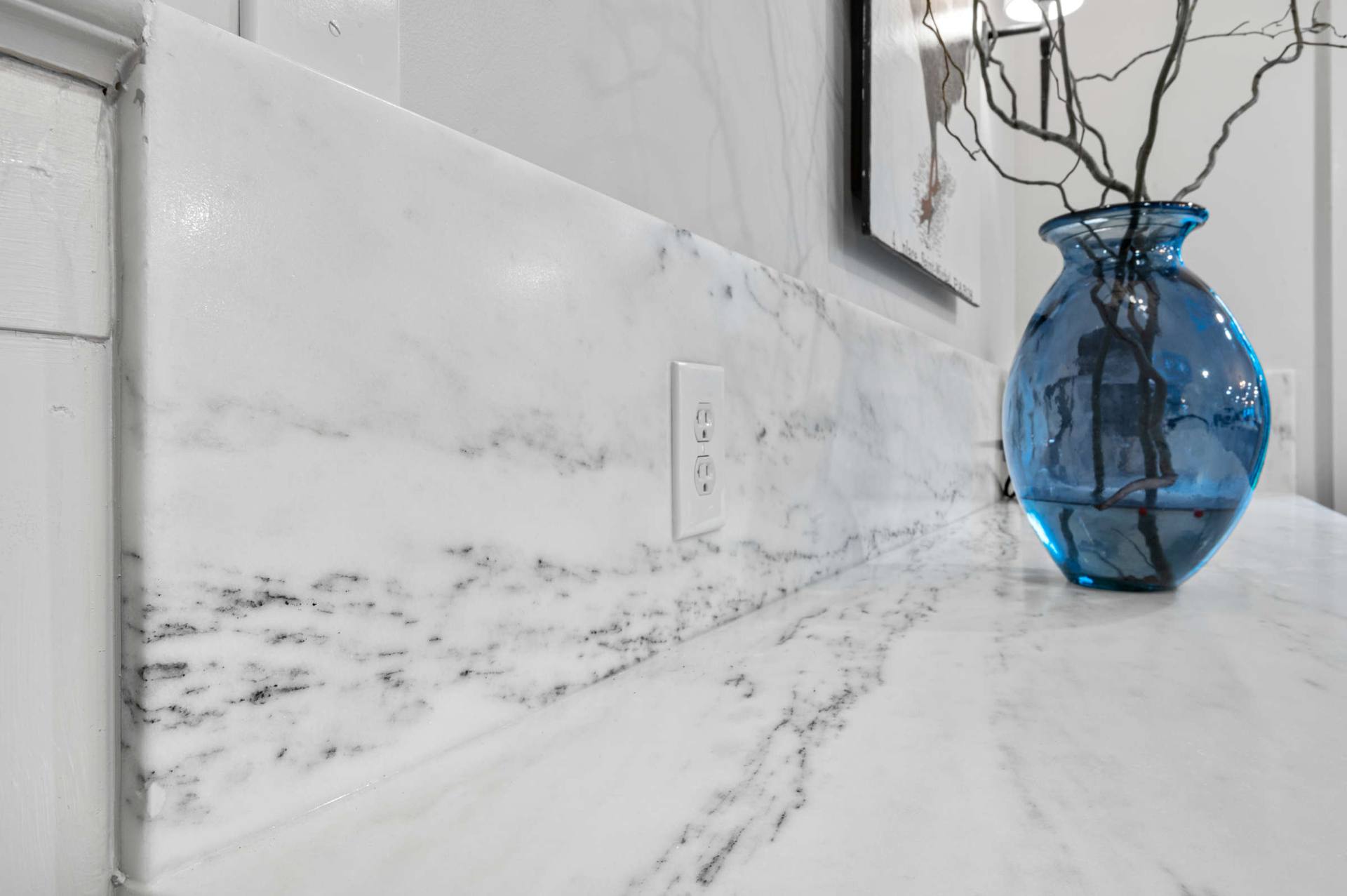 Close view of gray veining in a honed Danby marble backsplash panel