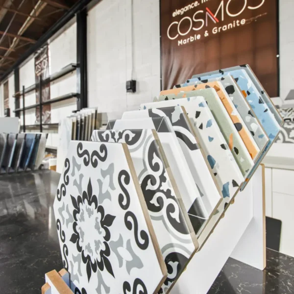 Patterned tile samples displayed inside the Cosmos showroom