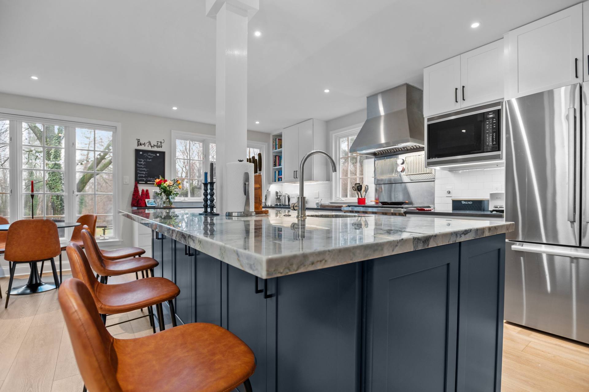 Ijen Blue quartzite countertops on a kitchen island and perimeter cabinets