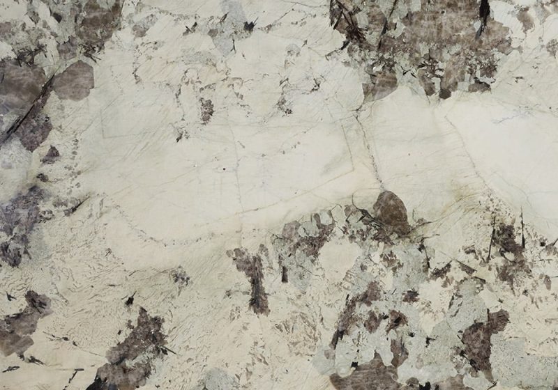 Tourmaline granite sample with cream, black, and gray mineral movement