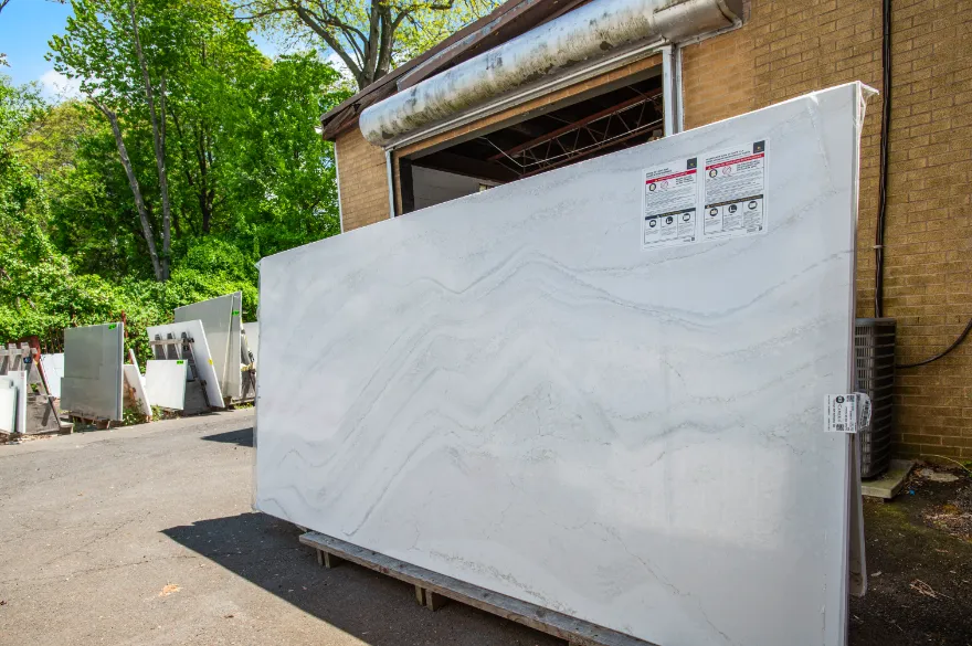 Large white stone slab displayed outside the Cosmos warehouse