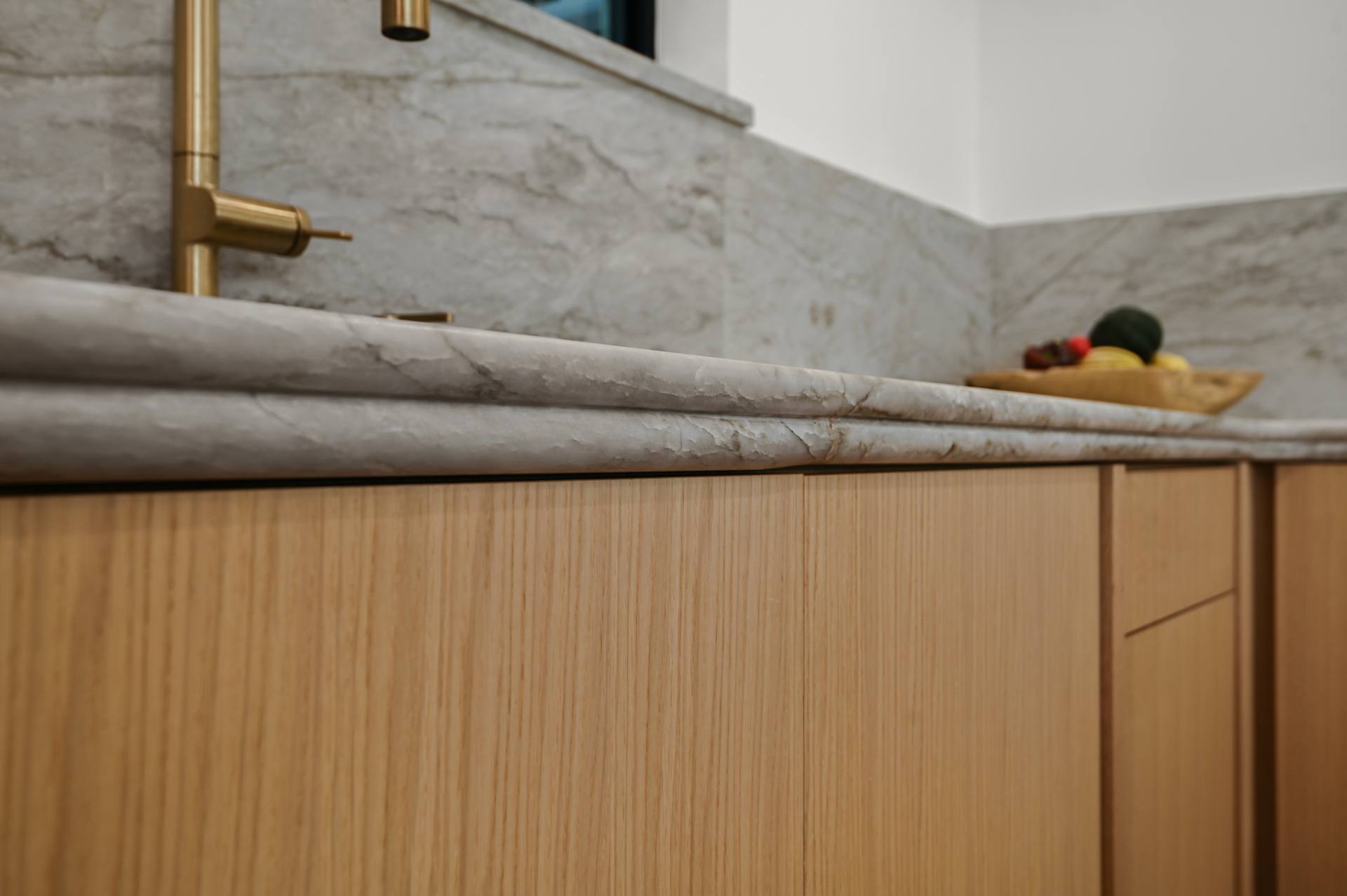Close-up of a double-laminated bullnose edge on Sea Pearl quartzite