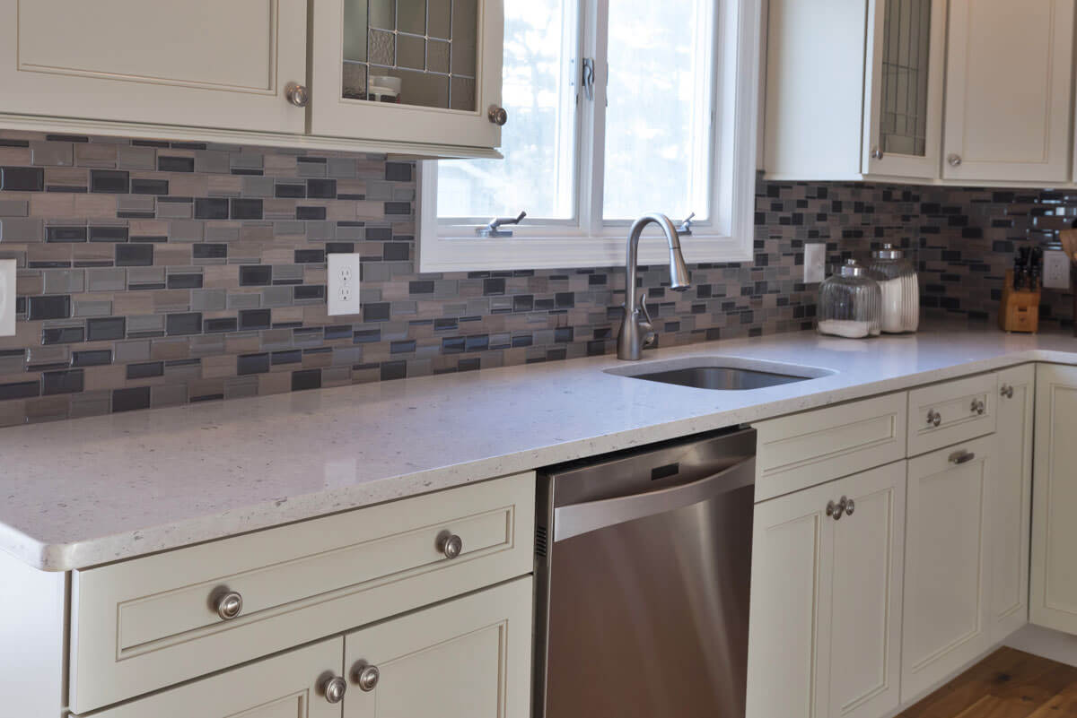 Silestone Bianco River countertop along the sink and dishwasher