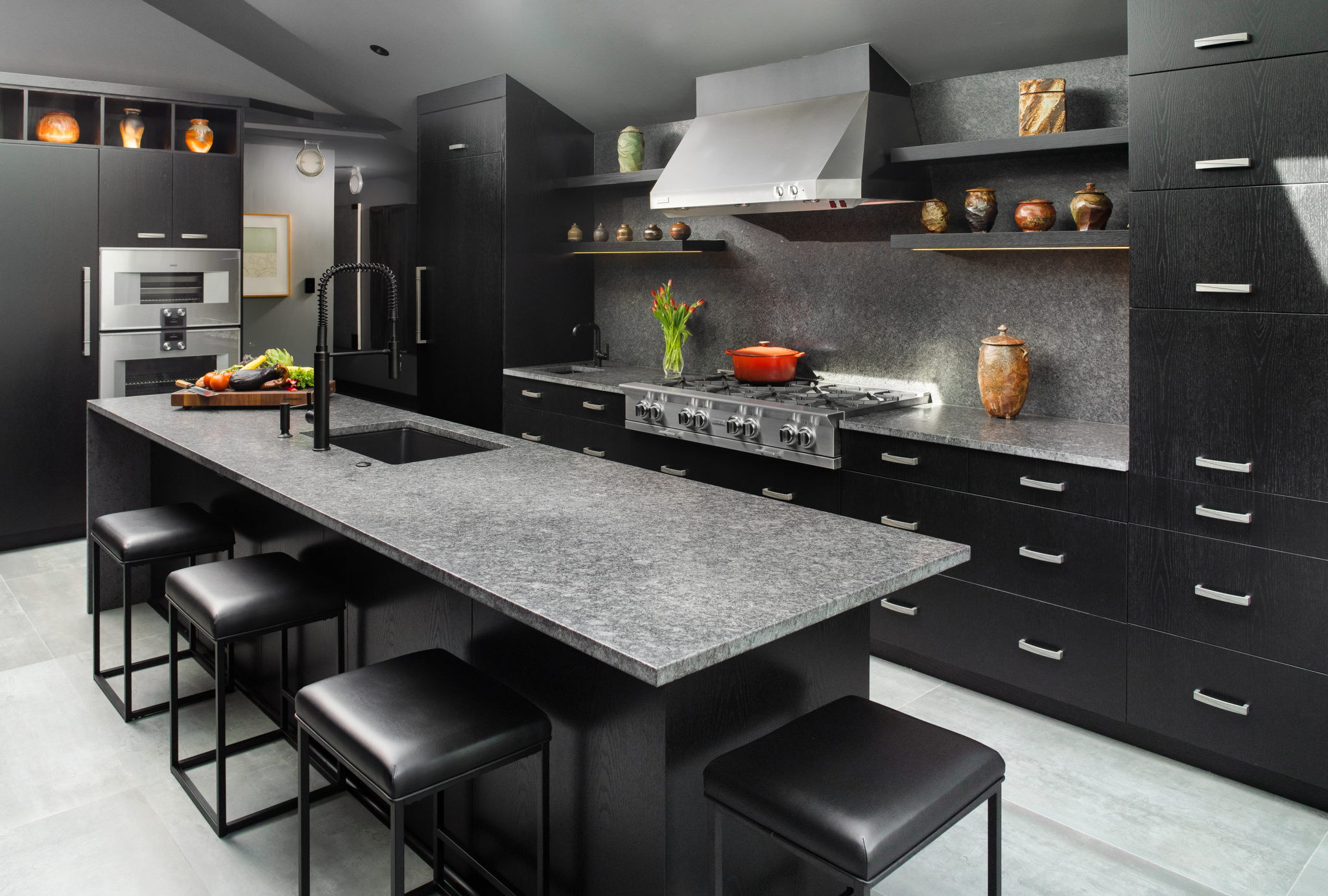Steel Grey Leather granite installed on a kitchen island, perimeter counters, and backsplash