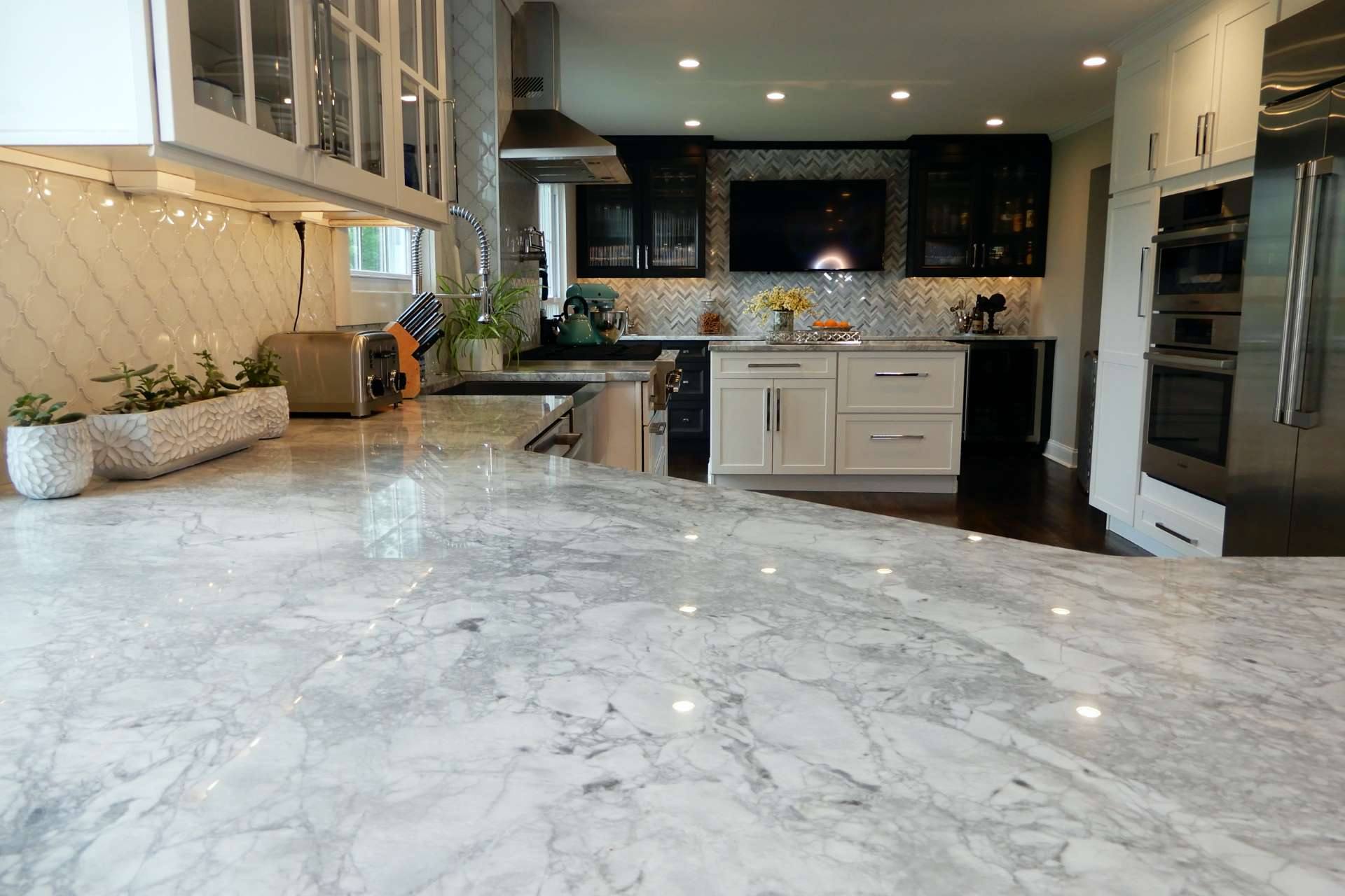 Soft gray clouding across a Super White quartzite countertop