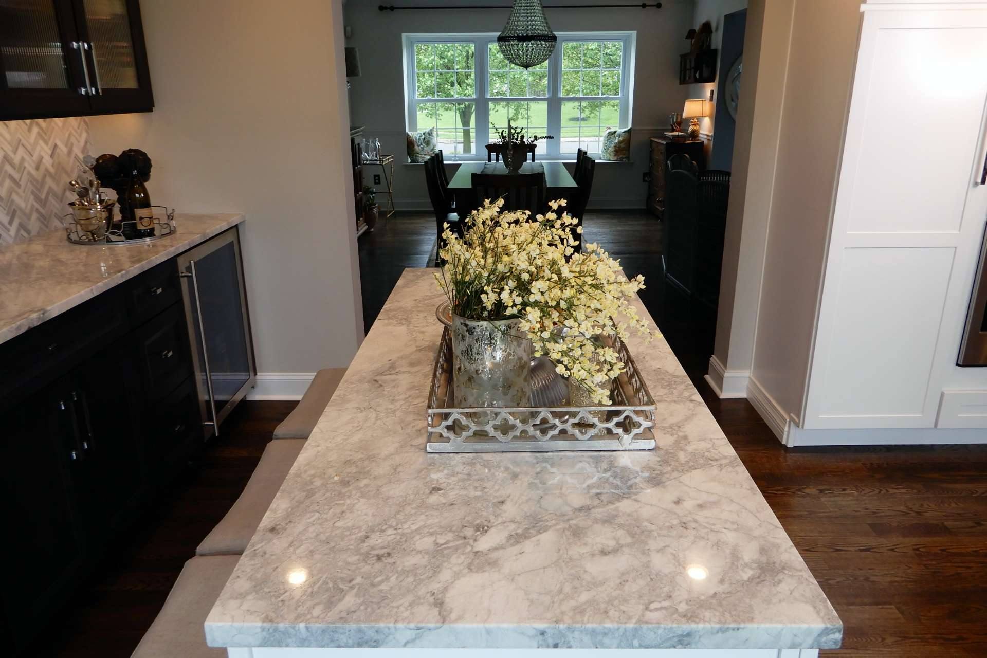 Long Super White quartzite peninsula top looking toward the dining room