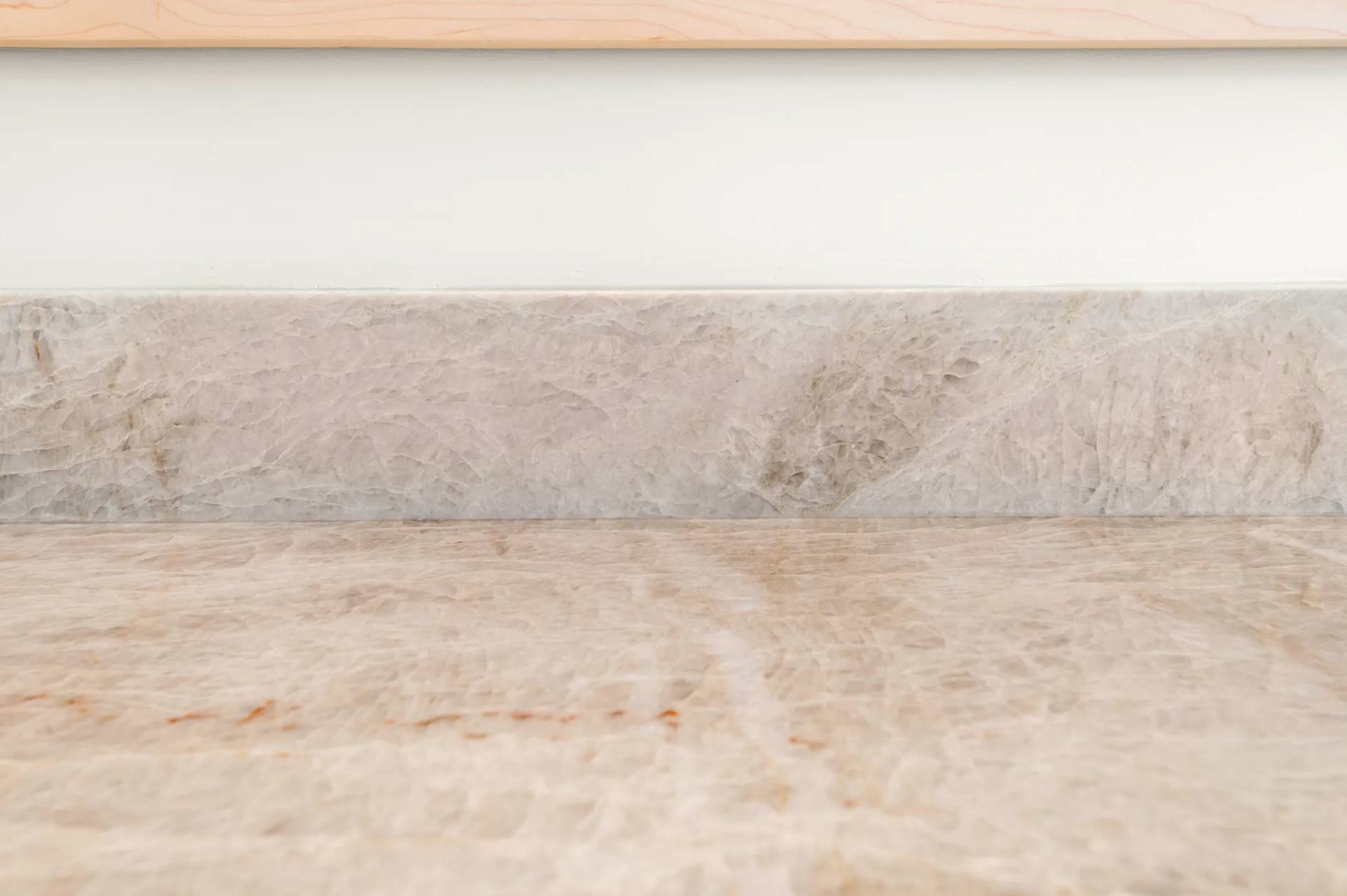 Close view of the soft cream and beige movement in Taj Mahal quartzite