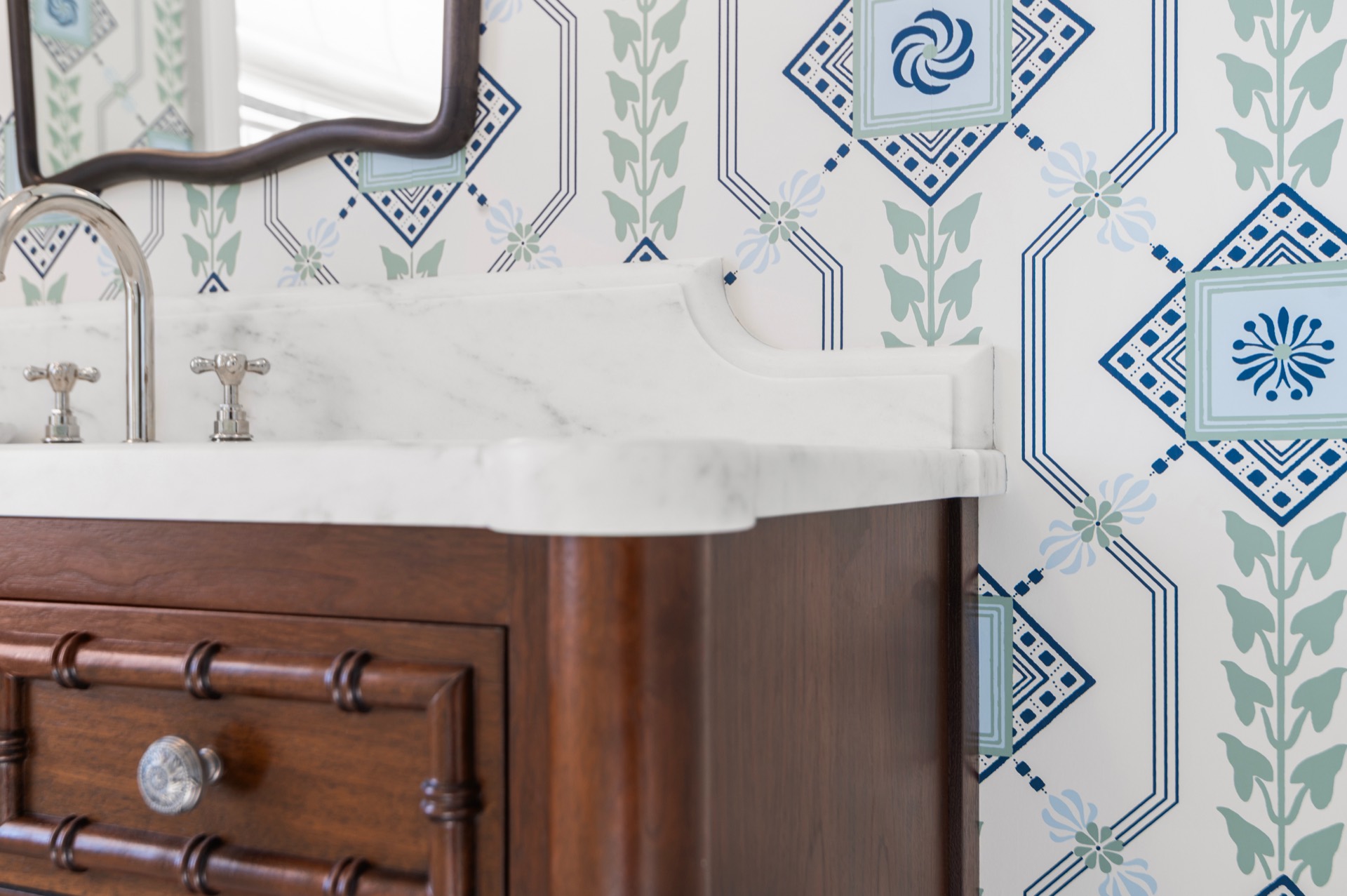 Scalloped corner detail on a White Carrara marble vanity top