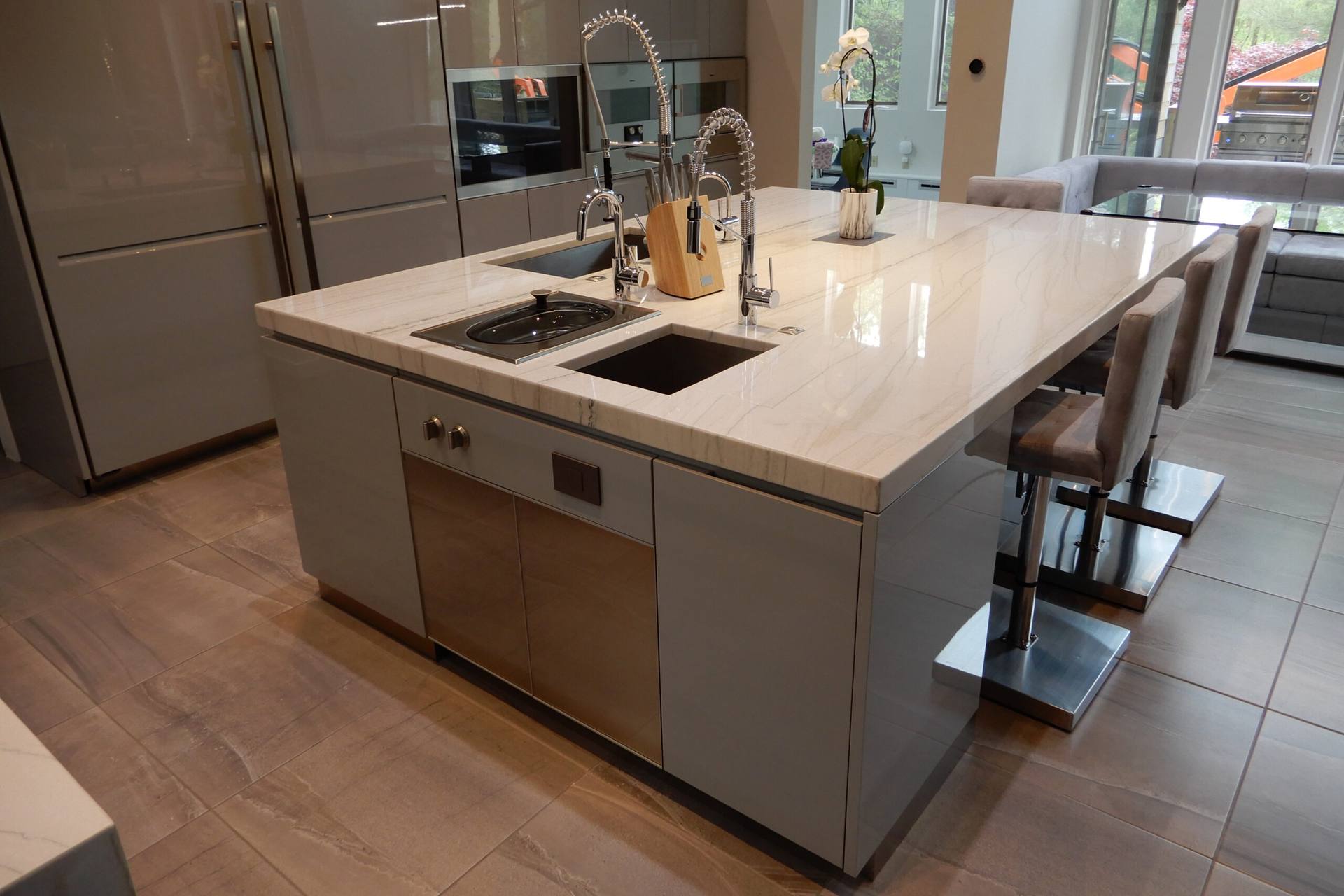 White Macaubas quartzite island with a waterfall end and counter seating